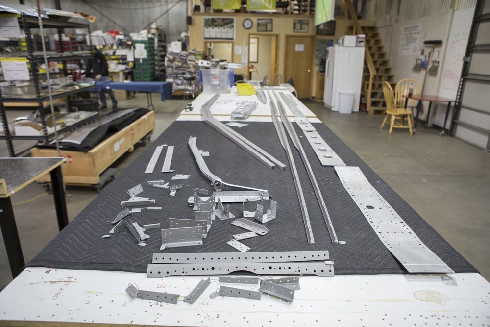 Stabilizer frame parts laid out for fitting.
