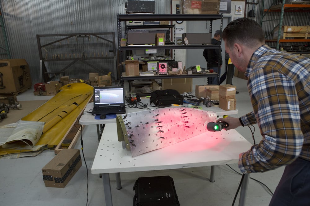 Stefan scanning a piece of wing tip skin.    