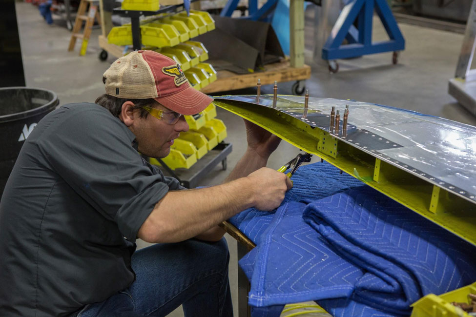 Brent takes out some Clecoes in preparation for replacing them withspecially made rivets that have a 115 degree head angle.