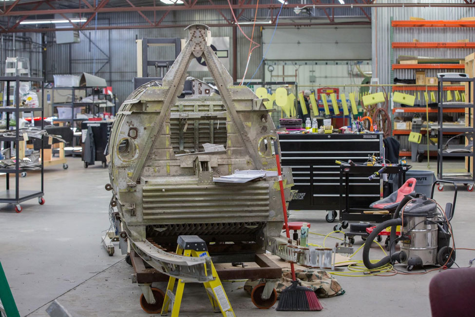 This rear view of the fuselage shows that most of the structure aft of the cockpit has been removed.