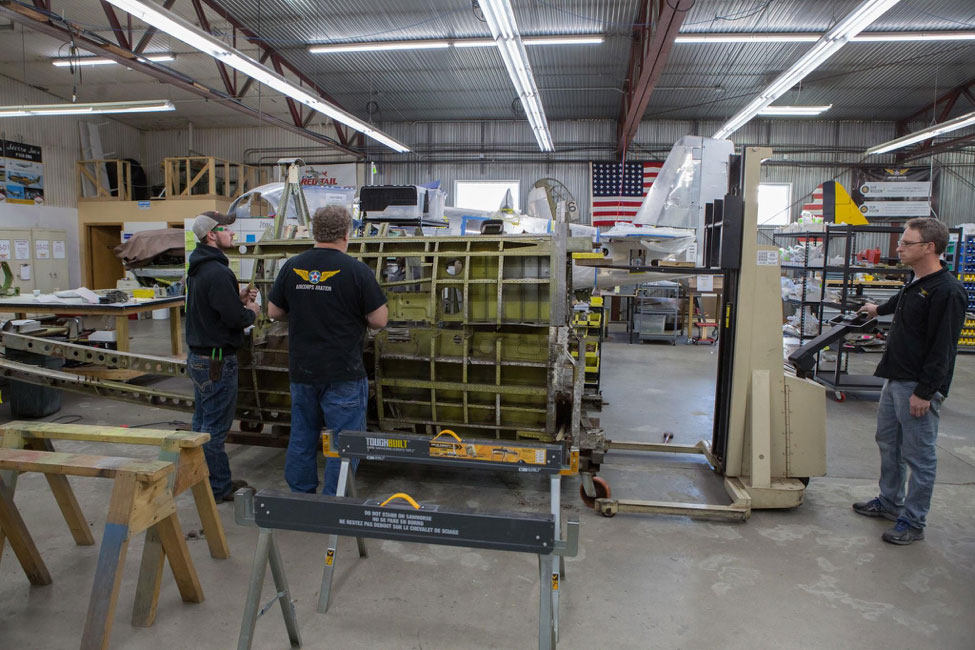 The rivets and bolts holding upper half of the forward fuselage have been drilled out or removed.