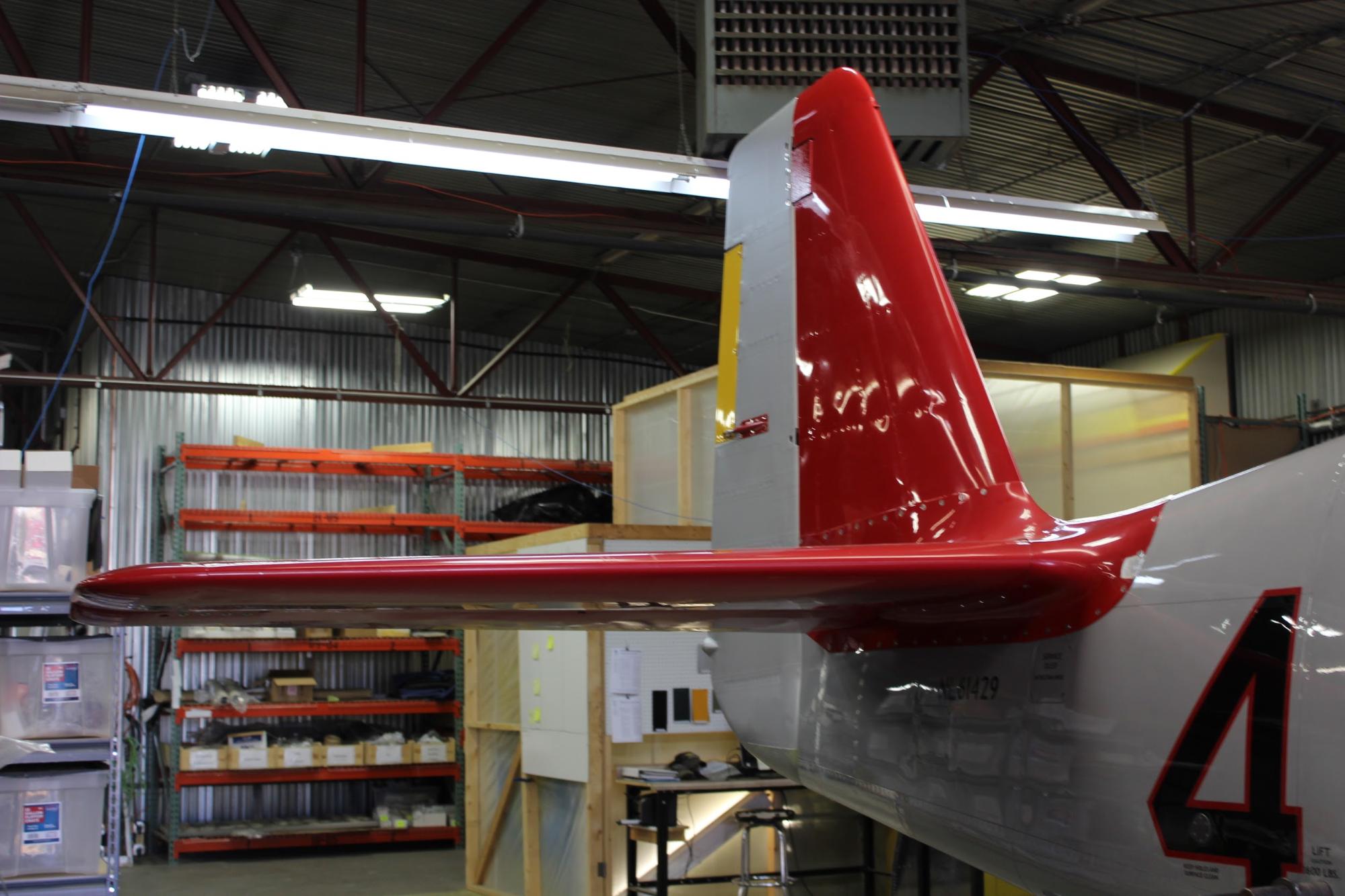 The signature red empennage, lacking only paint on the rudder. The whole airframe will be repainted in any case.