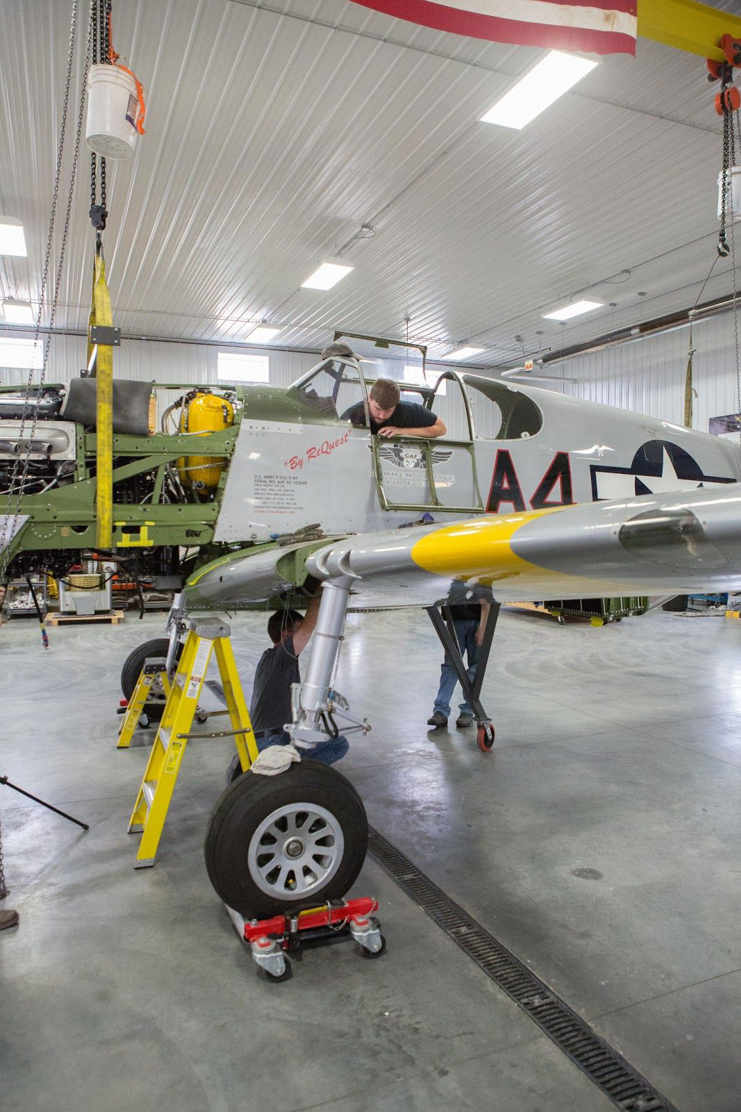 One more wing assembly photo: Tye and Mark install one of the four large bolts that attach the wing to the fuselage.