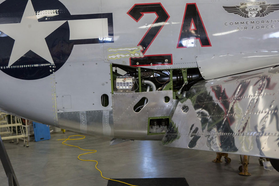 “The machined aluminum part visible near the center of the image is a Hinz Filter. Named after Don Hinz, who tragically lost his life in the Red Tail P-51C in 2004, the filter is a bypass oil filter that detects if the Merlin is starting to “make metal”. The bypass oil filter’s sensors will alert the pilot to an engine problem.”