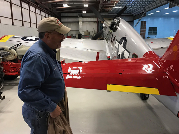 Doug Rozendaal looks her over.  Doug not only test flew the Red Tail after repair, but also recently returned to the Squadron Leader position at the CAF Red Tail Squadron.