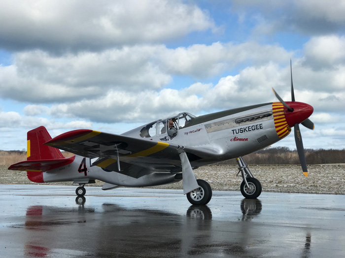 The P-51C is completely finished in this side view of the Red Tail in her new paint. ((Photo Credit: Adam Glowaski)