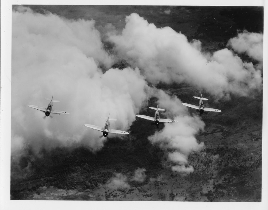 39th Fighter Squadron P-47s fly over Papua New Guinea