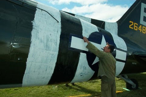 Applying Invasion Stripes at Oshkosh 2013