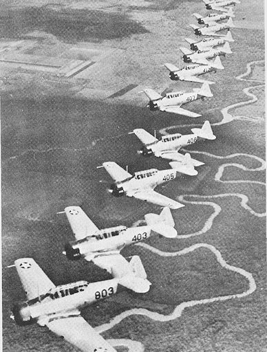 Formation of 12 AT-6 trainers over the Guadalupe River near Foster Field, Summer 1942, USAAF photo